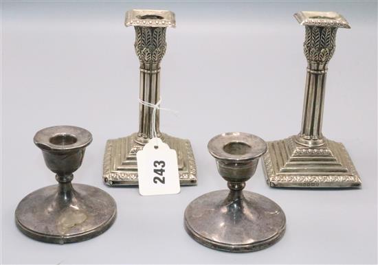 Two pairs silver candlesticks